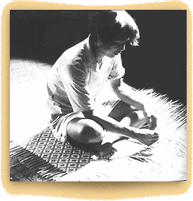 guy weaving rattan